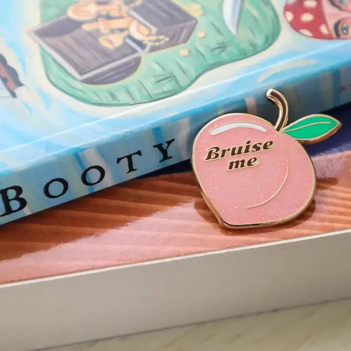 Vibrators Cunning Linguist Bruise Me Peach Enamel Pin
